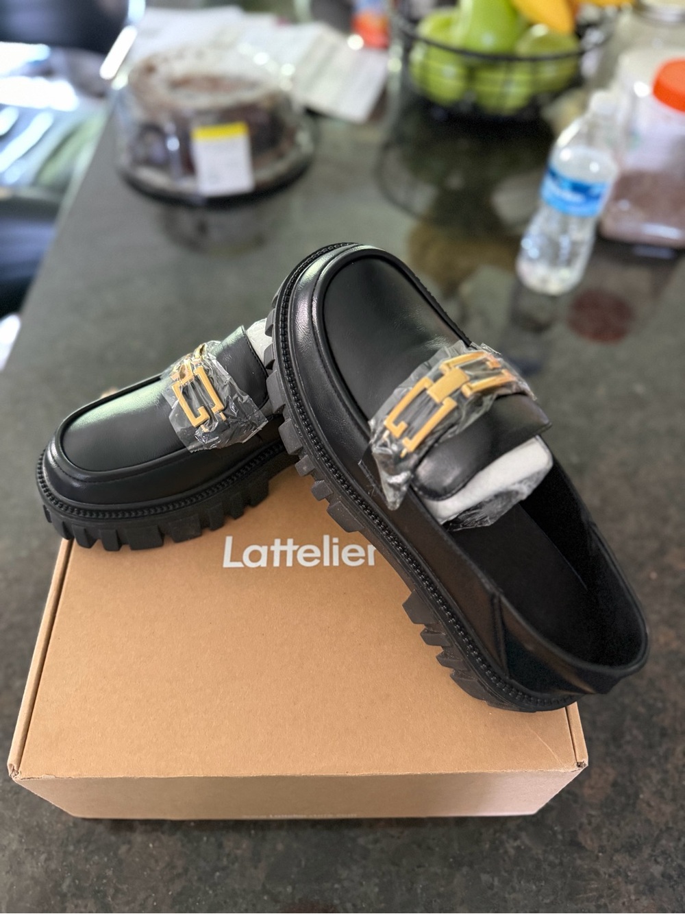 Lattelier Black Leather Lug Sole Loafers with Gold Accent